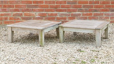 Lot 1447 - A pair of Gloucester teak low garden tables