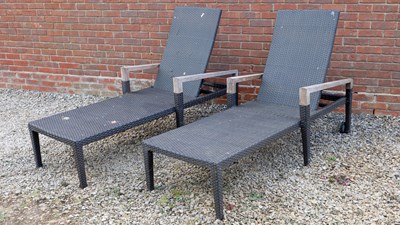 Lot 1358A - A pair of Gloucester teak and rattan style garden loungers
