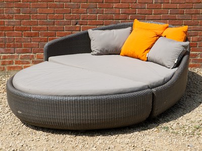 Lot 1336 - A large Gloster lounger and a circular occasional table