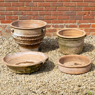 Lot 1369 - A group of two Continental terracotta planters, together with two shallow dishes