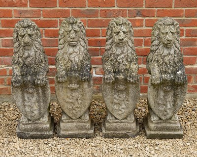 Lot 1376 - A group of four cast heraldic lions