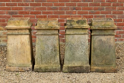 Lot 1484 - A group of four buff terracotta rectangular-section chimney pots