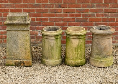 Lot 1428 - A Victorian buff terracotta rectangular-section chimney pot and three further circular chimney pots
