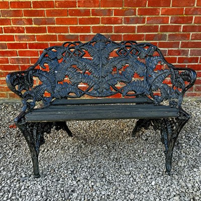 Lot 1440 - A black painted Coalbrookdale-style bench