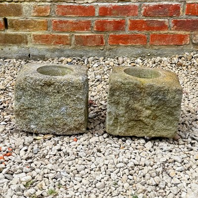 Lot 1420 - A pair of carved rusticated stone planters