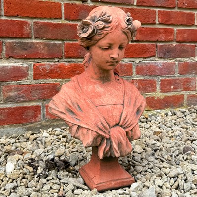 Lot 1326 - A bust of a young girl with flowers in her hair