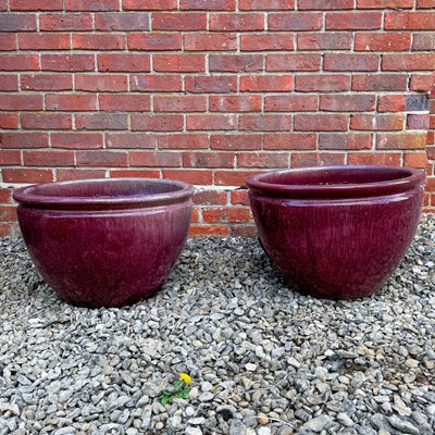 Lot 1483 - A pair of pink glazed ceramic planter