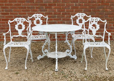 Lot 1434 - A cast aluminum garden table and four chairs