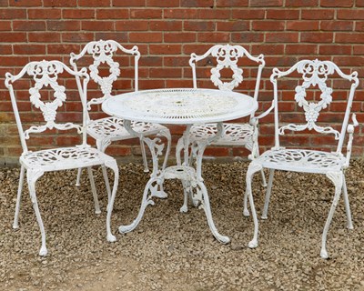 Lot 1509 - A garden table and four chairs