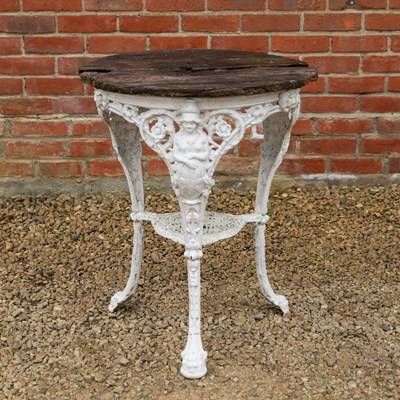 Lot 1489 - An old white painted cast iron pub table