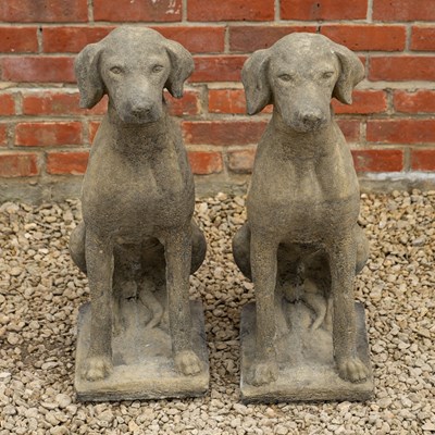 Lot 1407 - A pair of cast reconstituted stone sculptures of seated labradors