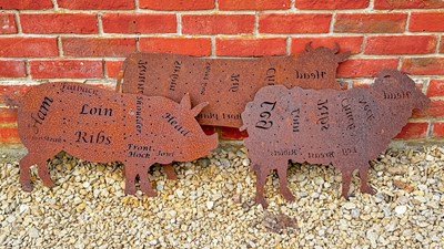 Lot 1346 - A group of three pierced steel profile plaques