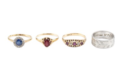 Lot 47 - A white precious metal wedding band, with...