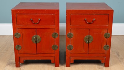 Lot 362 - A pair of Chinese red lacquered bedside cabinets