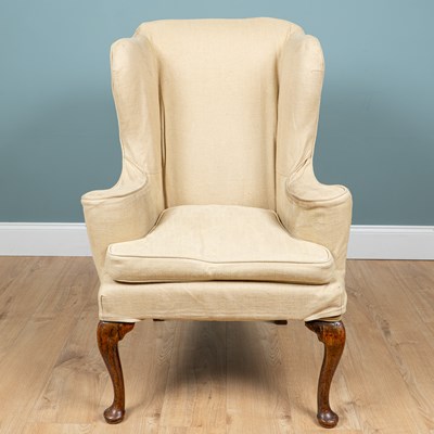 Lot 20 - A George III wingback armchair