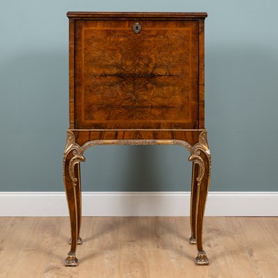 Lot 379 - An 18th century and later walnut drinks cabinet on stand
