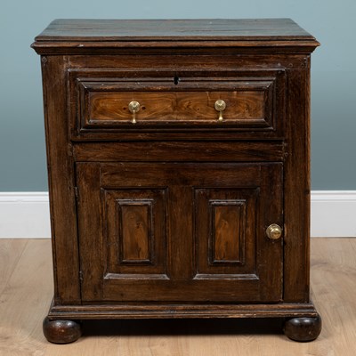 Lot 1194 - An antique oak side cabinet