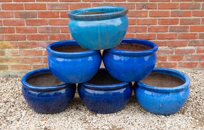 Lot 1322 - A group of six similarly sized blue and turquoise glazed garden pots