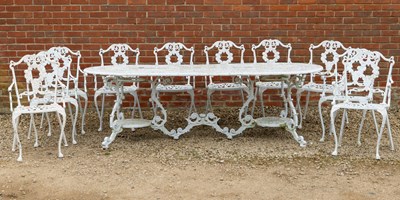 Lot 1427 - A large D-end garden table and chairs