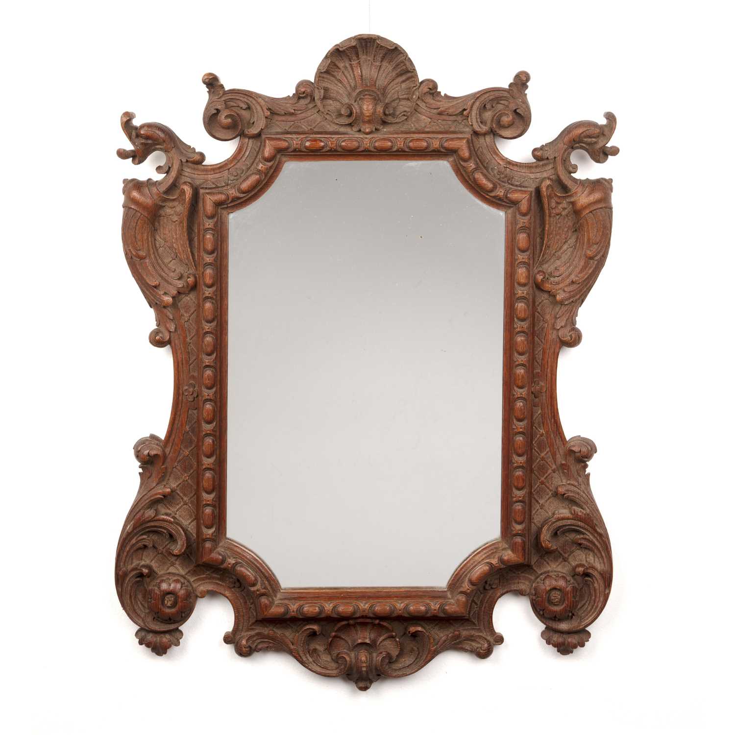 Lot 36 - Carved oak mirror 19th Century, with gryphon,...