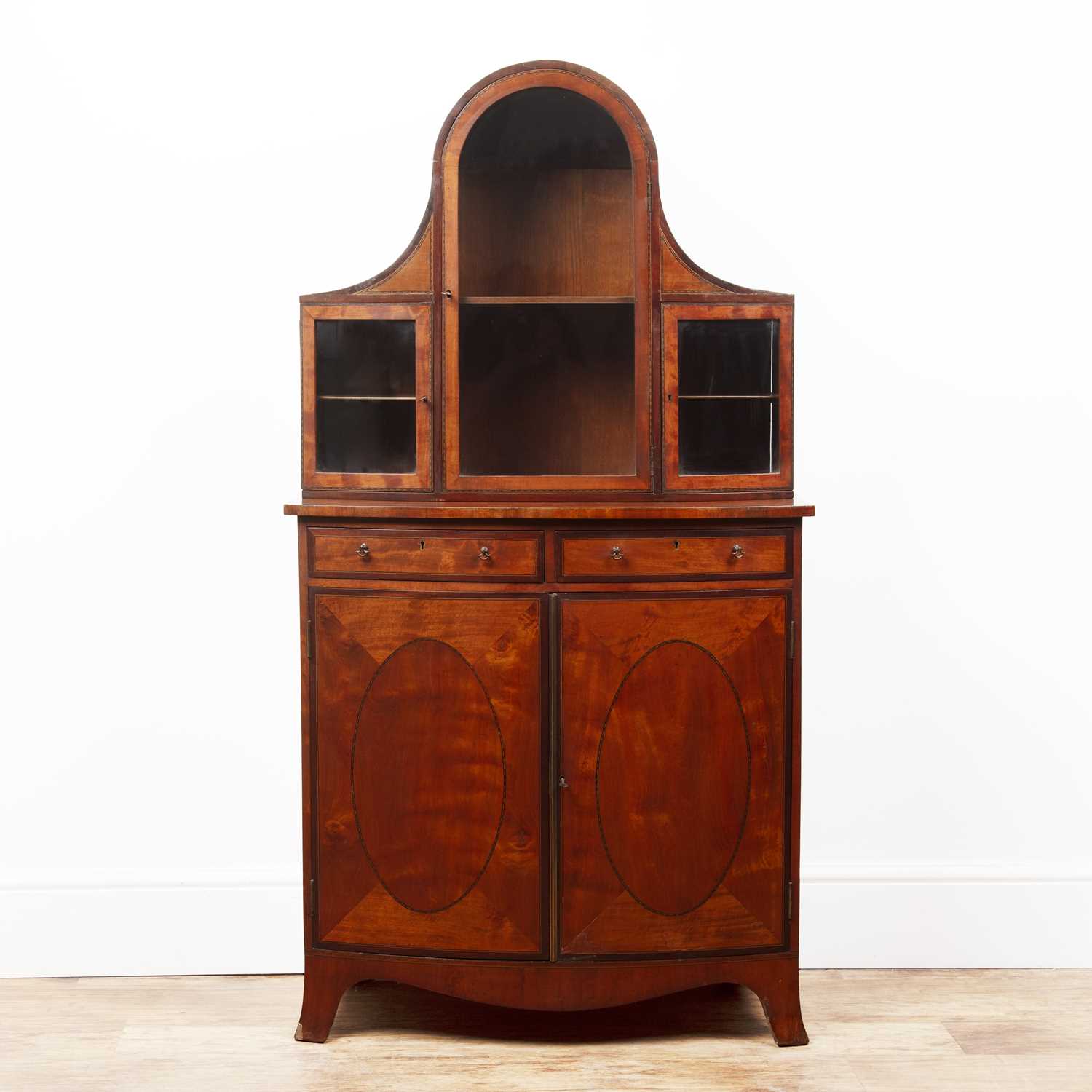 Lot 29 - Satinwood bow cabinet with an inlaid glazed...