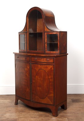 Lot 29 - Satinwood bow cabinet with an inlaid glazed...