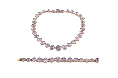 Lot 29 - An amethyst rivière necklace and bracelet...