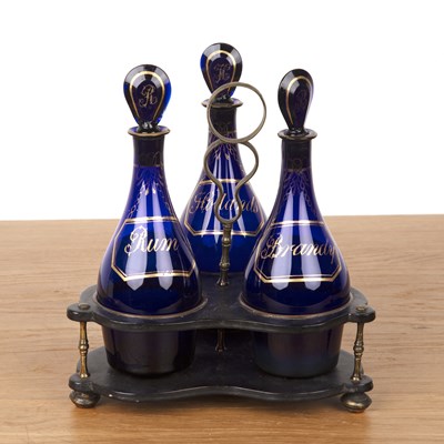 Lot 256 - Three Bristol blue bottles in papier mache...
