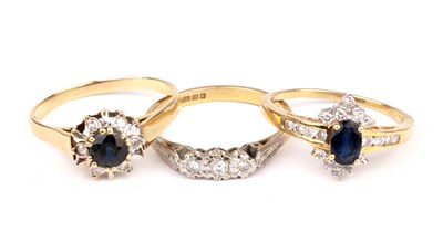 Lot 226 - Three 18ct gold rings one set with three...