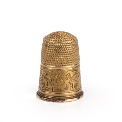 Lot 237 - 9ct gold thimble With foliate engraved band,...
