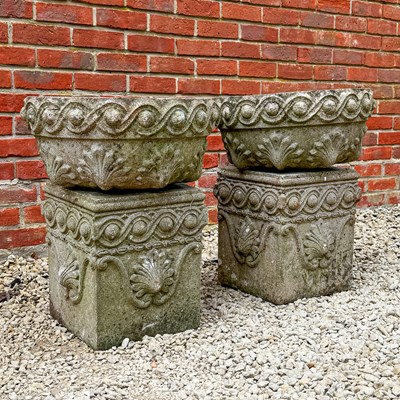 Lot 1533 - A pair of cast reconstituted stone bowl-shaped planters and matching square-section plinths