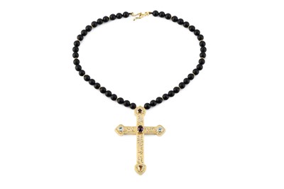 Lot 55 - A vari gem-set cross pendant, applied with...