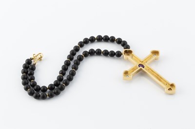 Lot 55 - A vari gem-set cross pendant, applied with...
