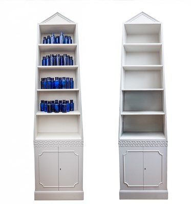 Lot 216 - A pair of pyramidal bookcases