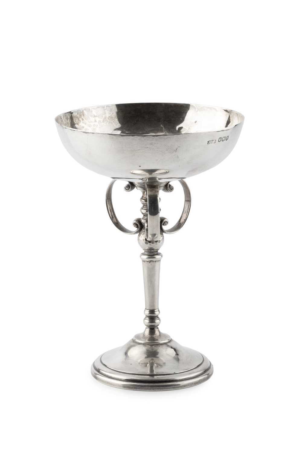 Lot A George V silver goblet, the wide planished...