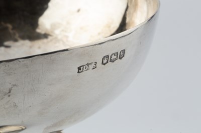 Lot A George V silver goblet, the wide planished...