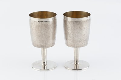 Lot 204 - A pair of silver goblets, of textured,...