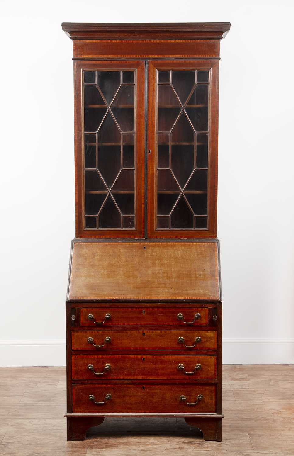 Lot 54 - Mahogany and satinwood bureau bookcase...