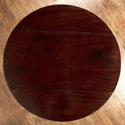 Lot 51 - Mahogany circular drop-leaf pembroke table...