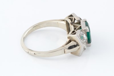 Lot 56 - An emerald and diamond dress ring, the...