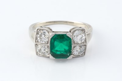 Lot 56 - An emerald and diamond dress ring, the...