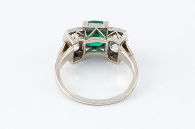 Lot 56 - An emerald and diamond dress ring, the...