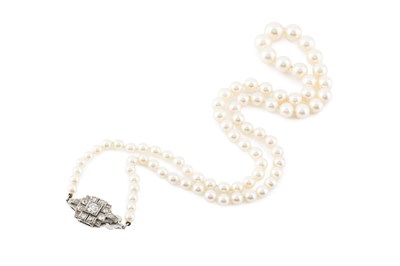 Lot A cultured pearl necklace with diamond set...