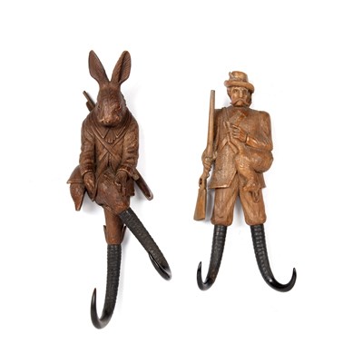 Lot 83 - Two Black Forest coat hooks One in the form of...