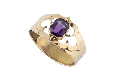 Lot An amethyst set bangle, the hinged oval bangle...