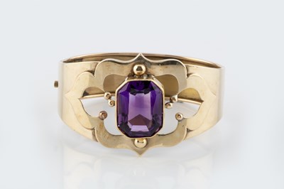 Lot 60 - An amethyst set bangle, the hinged oval bangle...