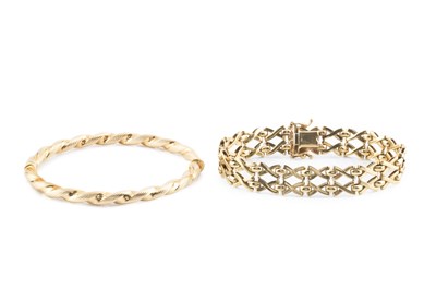 Lot 90 - A yellow precious metal fancy-link bracelet,...