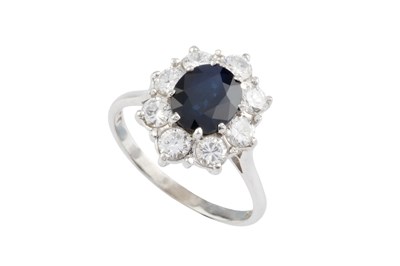 Lot A sapphire and diamond cluster ring, the oval...