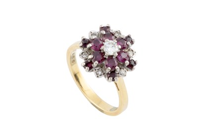 Lot 59 - A ruby and diamond cluster ring, designed as a...