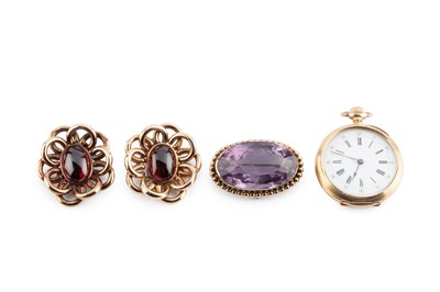Lot 46 - A pair of garnet ear clips, each oval cabochon...